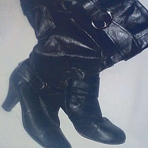 Woman's knee high boots with buckles